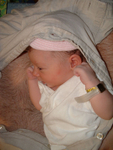 Nestled in her daddy's shirt